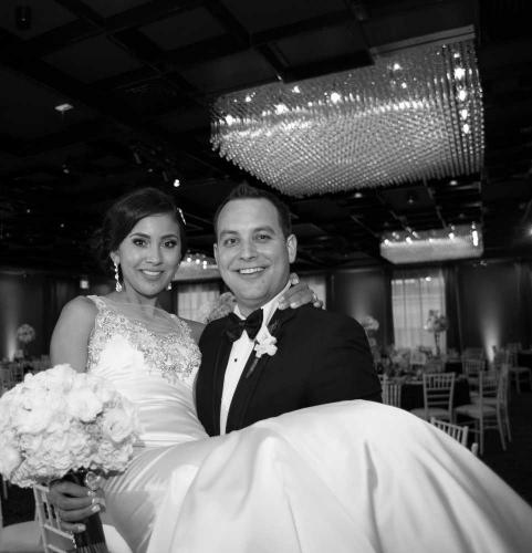 bride-groom-black-white-photo-groom-holding-bride-inside-glendale-event-venue