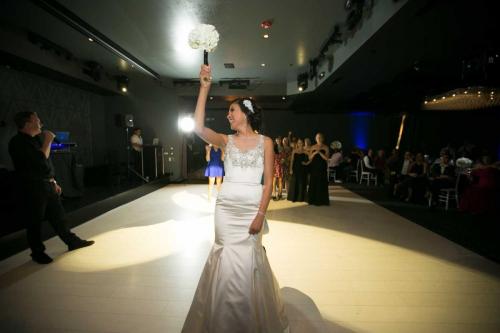 wedding-bride-inside-event-venue-throwing-bouquet-2