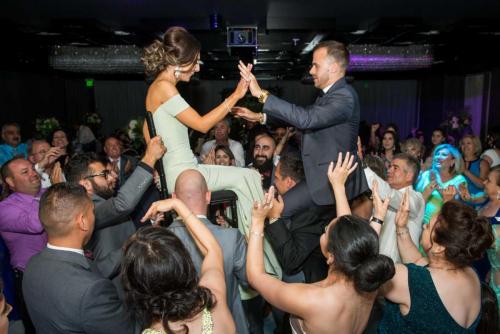 couple-on-chairs-dancing-crowd-inside-vertigo-event-venue-los-angeles