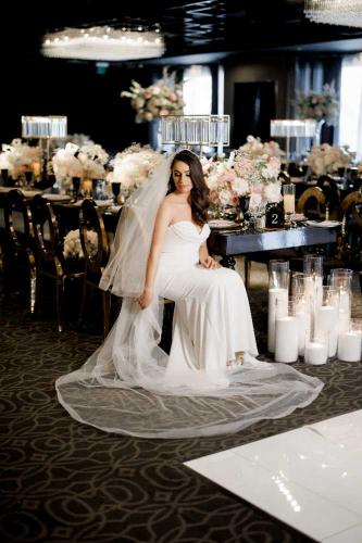 bride-seating-down-posing-inside-event-venue