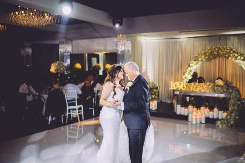 wedding-couple-dancing-on-dance-floor-inside-event-venue